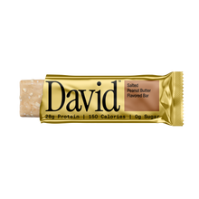 David protein bar with gold wrapper on a black background