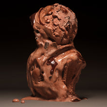 Chocolate ice cream scoops against a dark background